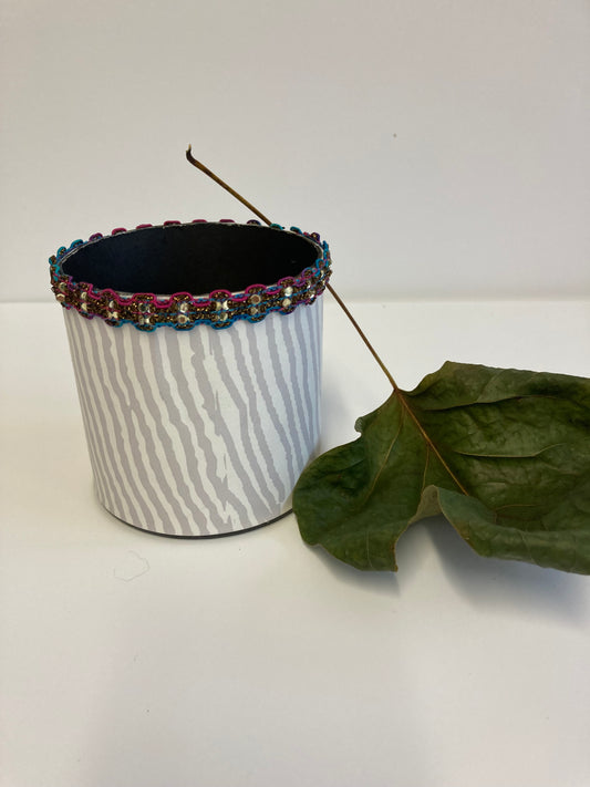 Small white pot with grey stripes